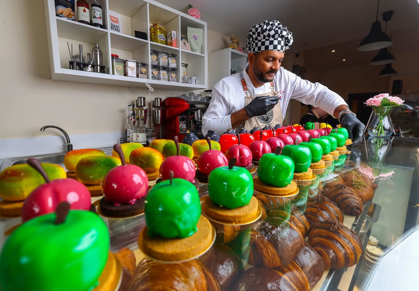 Victor arranging the full patisserie counter display