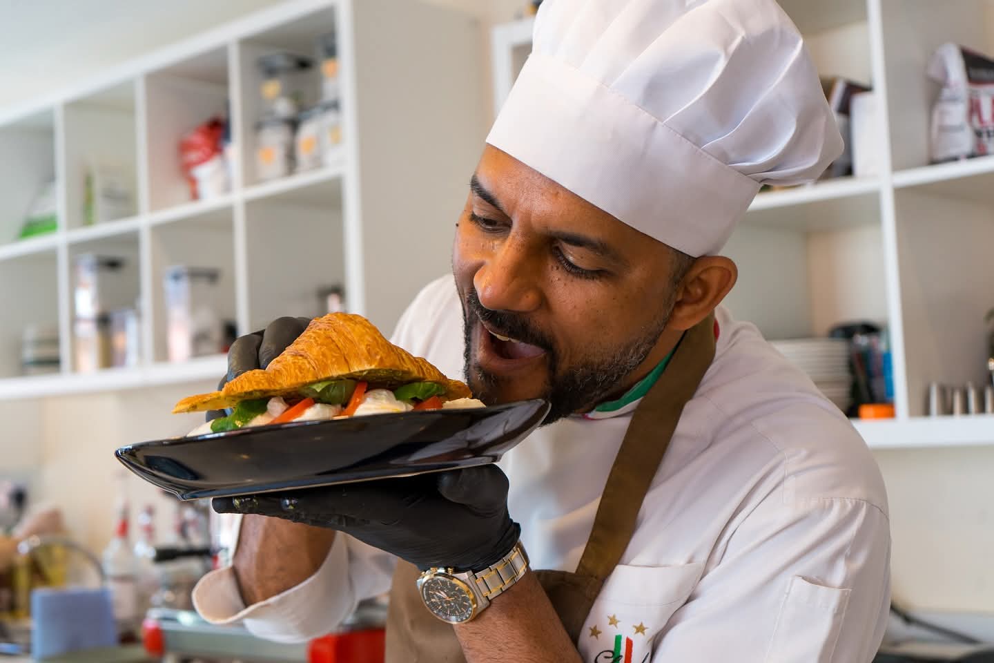 Chef Victor presenting a freshly made savoury croissant
